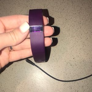 Purple fit bit with charger